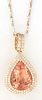 14K Yellow Gold Pendant, with a pear shaped 23.23 carat morganite atop a conforming double concentric border of round diamonds, with a diamond mounted