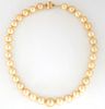Graduated Strand of Rare Natural Golden Tahitian Cultured Pearls, ranging from 12-15 mm, with a 14K yellow gold ball clasp, L.- 18 in., with appraisal