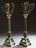 Pair of Empire Style Patinated and Gilt Bronze Six Light Candelabra, 19th c., with five patinated acanthine curved arms around a straight central gilt