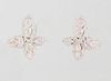 Pair of 18K White Gold Earrings, of X-form, the four arms with center pink diamonds within a border of tiny round diamonds, with screw backs, pink dia