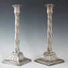 Pair of English Silverplated Copper Single Candlesticks, 19th c., with relief bobeches on a relief acanthus leaf candle cup, on a twisted support, to 