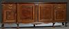 English Carved Mahogany Bowfront Sideboard, early 20th c., the stepped rounded edge breakfront top over central convex double cupboard doors, flanked 