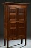 Louisiana Carved Walnut Pie Safe, late 19th c., the stepped ogee crown over double cupboard doors above larger cupboard doors over two frieze drawers,