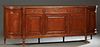 French Louis XVI Style Carved Cherry Marble Top Sideboard, 20th c., the stepped serpentine top over two frieze drawers above double fielded panel cupb