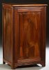 Spanish Renaissance Style Carved Walnut Confiturier, 19th c., the stepped sloping edge top over a setback relief linenfold carved fielded panel door, 