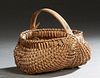 Native American Split Hickory Handled Buttocks Basket, 20th c., probably Cherokee, H.- 8 1/2 in., W.- 10 in., D.- 9 in.