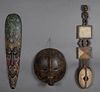 Group of Three Carved Wood African Masks, 20th c., consisting of a tall narrow example with pointillist and lizard decoration; a round mask , Luba, Co