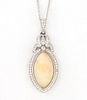Lady's Platinum Pendant, with a marquise 8.04 carat cabochon opal atop a border of tiny round diamonds, with a pierced diamond mounted bezel and a dia