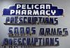 Blue Enamel Sign for Pelican Pharmacy, New Orleans, with three sets of letters two spelling out "prescriptions," one "drugs," and one "sodas," H.- 14 