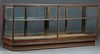 Carved Mahogany Store Display Counter, early 20th c., with double glass tops, double glass fronts and sides, verso with four sliding glass doors, on a