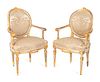 A Pair of Italian Neoclassical Painted and Parcel Gilt Armchairs
Height 39 inches.