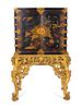A Chinese Brass-Mounted Gilt-Decorated Black Lacquer Cabinet on Later Giltwood Stand
Height 59 x width 32 1/2 x depth 17 inches.
