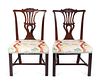 A Pair of George III Carved Mahogany Side Chairs Height 36 1/2 x width 22 1/2 inches.