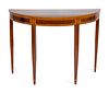 A George III Style Satinwood-Inlaid Mahogany Demilune Table
Height 34 x width 47 x depth 21 1/2 inches.
