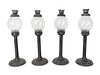 A Set of Four English Tole and Glass Hurricane Candlesticks
Height 16 inches.