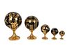 Five Italian Parcel-Gilt and Black-Glazed Porcelain Globes
Heights 4 3/4 to 14 inches.