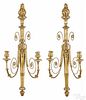 Pair of Empire giltwood sconces, 19th c., with flame finials, lion masks, and scrolled arms