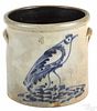 Four-gallon stoneware crock, 19th c., with a cobalt bird in a nest, 11 1/4'' h.