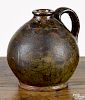 Pennsylvania redware ovoid jug, 19th c., with unusual crackled glaze, 6'' h.