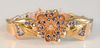 14 Karat Gold Bracelet
having three dimensional flower with blue sapphires and diamond center with sectioned band
length 6 1/2 inches, 37.8 grams tota