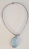 Designer Sterling Silver Necklace
with large teardrop shaped carved light blue stone
signed AB.
29.5 millimeters x 47 millimeters