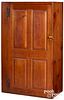 New England stained pine raised panel cupboard