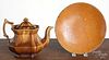 Redware pie plate, 19th c., 9 3/4'' dia., together with a Rockingham glaze teapot, 7 1/2'' h.