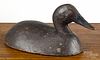 Two carved and painted duck decoys, mid 20th c., the canvasback attributed to Michigan, 15'' l.