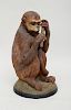 VICTORIAN PAINTED TERRACOTTA MODEL OF A SEATED MONKEY