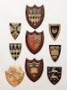 MISCELLANEOUS GROUP OF PAINTED WOOD, TIN AND GILTWOOD COAT-OF-ARMS