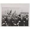 [KING, Martin Luther, Jr. (1929-1968)]. Press photograph of Martin Luther King locking arms with his aides while leading march to the Montgomery, AL c