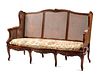 A French Provincial Caned Settee