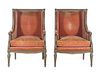 A Pair of Louis XVI Carved and Painted Walnut Bergeres a L'Oreilles