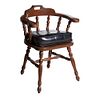 Sillón. Siglo XX. En talla de madera. Con respaldo semiabierto, asiento con cojín tipo piel color negro.