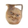 A Martin Brothers Salt Glazed Stoneware Face Jug Height 6 7/8 inches.