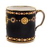 * A Sevres Jeweled Porcelain Cup Height 2 3/8 inches.