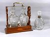 English Inlaid Oak Tantalus and Two Crystal Decanters
