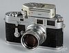 Leica M3 camera with light meter and lens.