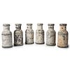 A Set of Six Painted and Weighted Metal Carnival Knock-over Bottles