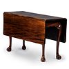 A Chippendale Figured Mahogany Ball-and-Claw Foot Drop Leaf Dining Table