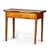 A Federal Tiger Maple Serpentine Top Game Table, New England, Circa 1800 