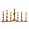 Seven English Brass Faceted Candlesticks, Including the "King of Diamonds"