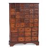 A Country Stained Pine and Cherrywood 54-Drawer Apothecary Chest