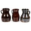 Three Albany Glazed Stoneware Pitchers