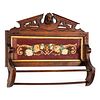 A Victorian Carved Walnut Hanging Rack with Inset Floral Needlepoint Panel