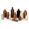 Thirteen Stoneware Inkwells and Bottles