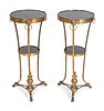 A Pair of Neoclassical Style Gilt-Bronze and Black Granite Gueridons
Height 28 1/4 x diameter 12 1/4 inches.