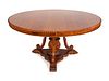 A Regency Style Carved Rosewood Tilt-Top Breakfast Table
Height 30 x diameter 60 inches.