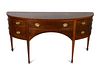A Federal Style Satinwood-Inlaid Mahogany Bow-Front Sideboard
Height 36 x length 73 x depth 26 inches.