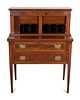 A Federal Inlaid Figured Mahogany Tabour Desk
Height 47 x width 34 1/2 x depth 18 inches.